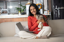Beautiful Asian Woman Holding Persia Cat In Hand At Home. Woman Look Happiness To Stay And Enjoy With Her Pet. Friendship, Love, Happiness, Lifestyle And Relaxation Concept.