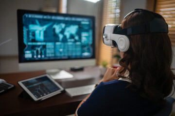 Futuristic women Engineer Wearing Virtual Reality Glasses working with a futuristic hologram to analysis and create alternative energy solutions with wind turbines