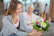 © auremar - daughter with flowers for mum