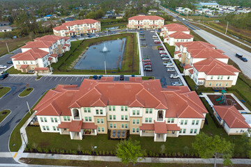 Wall Mural - Aerial view of american apartment buildings in Florida residential area. New family condos as example of housing development in US suburbs