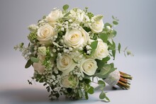 Bridal Bouquet Composed Of White Roses, Baby's Breath, And Luscious Green Leaves, Symbolizing Love And New Beginnings