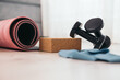 © ADDICTIVE STOCK - Dumbbells and mat with yoga block on floor