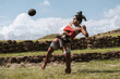 © ADDICTIVE STOCK - Portrait of a characterized woman playing mayan game with a rubber ball