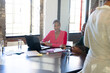 © Wavebreak Media - African american colleagues with documents and graphs on table using laptop in office