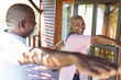 © Wavebreak Media - Happy senior african american couple practicing yoga on terrace