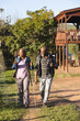 © Wavebreak Media - Senior african american couple with backpacks walking in sunny nature