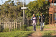 © Wavebreak Media - Senior african american couple with backpacks walking in sunny nature