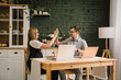 © Serhii - Two happy successful excited traders investors giving high five, celebrating success stock exchange trading deal, rising crypto bull market shares, growth bitcoin stock, ipo profit victory concept.