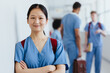 © Jacob Lund - Asian nursing student wearing scrubs in a hospital during training