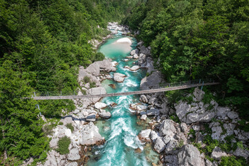 Canvas Print - Aerial drone view of suspension bridge over Soca river in Slovenia