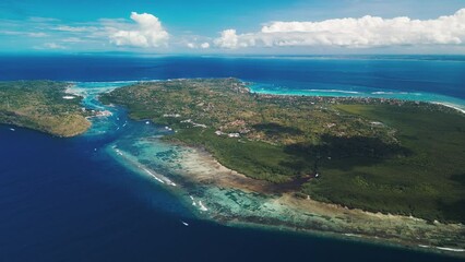 Poster - Nusa Penida, Bali, Indonesia. Aerial view of the island of Nusa Penida during sunny day with fluffy clouds in the sky