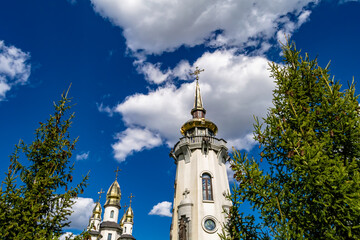 Christian church cross in high steeple tower for prayer