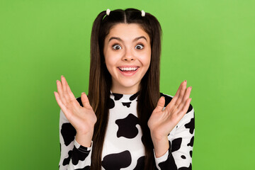 Poster - Portrait of astonished positive girl beaming smile raise opened arms palms applaud isolated on green color background