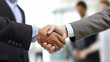 © ASHFAQ - Business people shaking hands