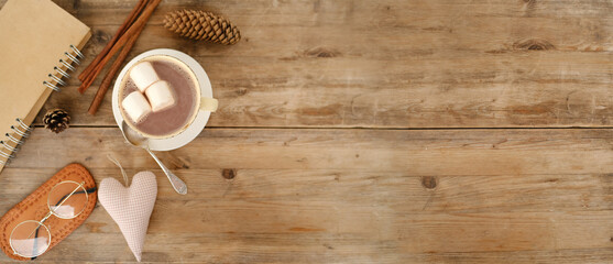 cup with drink coffee cappuccino, hot chocolate, marshmallows, garlands, winter clothes, caffeine improves functioning of human brain, stimulates nervous system, health benefits and harms, copy space