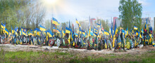 Cemetery Panorama. Graves Of Soldiers With Ukrainian Flags