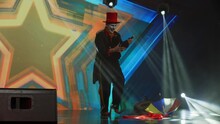 Creepy Clown Mime Showing Magic Tricks On Stage During Talent Show Audition. Broadcast Television Style TV Entertainment Program 