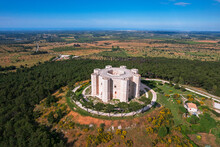 Aerial View Of The White Octagonal Castle Of Castel Del Monte Rising In The Middle Of The Countryside, UNESCO World Heritage Site, Apulia