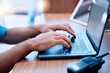© Tamline L/peopleimages.com - Laptop, radio and hands of security typing or writing an investigation project at a law enforcement office. Police, keyboard and person or officer working on internet crime and criminal email online