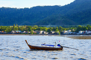 Longtail boat in the Andaman Sea in Lanta Old Town, aka Ban Lanta is a small fishermen village located on the east coast of Koh Lanta Yai island in the Province of Krabi, Thailand