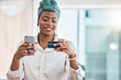 © Tamline L/peopleimages.com - Work, online shopping and a black woman with a credit card and phone for ecommerce or banking. Happy, finance and an African girl or employee making a payment on a mobile app from the office