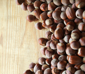 Wall Mural - Hazelnuts on a wooden table