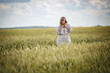 © hiv360 - beautiful girl in a linen dress in a wheat field