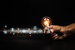 © Jintana - Close up hand choose light bulb or lamp with bright for human resources or leadership and creativity thinking idea motivation or vision and knowledge learning.