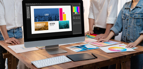 Aufkleber - Graphic designer brainstorming logo and graphic art at busy artistic workshop, laptop display workspace. Experimenting color palette and pattern for creative design. Panorama shot. Scrutinize