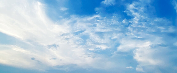 Wall Mural - Blue sky clouds background, beautiful landscape with clouds and sky, beautiful blue sky clouds for background. Panorama of sky, white cumulus clouds formation in blue sky.
