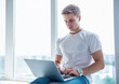 © georgerudy - Handsome young man with gadget