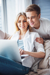 Canvas Print - Beautiful young couple with gadget