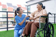 Caucasian Nurses assisting elderly people at retirement home.
