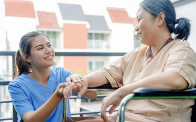 Caucasian Nurses assisting elderly people at retirement home.