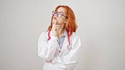 Poster - Young redhead woman doctor standing with doubt expression thinking over isolated white background