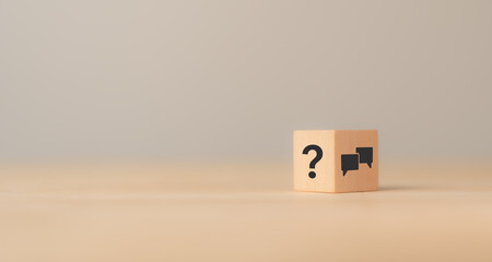 q and a concept. q and a symbols on wooden cube block on a grey background. illustration for frequen