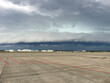 Shot of an arcus storm cloud gust front moving over the buildings of an airport