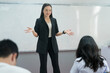 © EduLife Photos - Female teacher giving lecture and explaining lesson to the college students in classroom