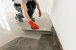 © Parilov - Screed concrete with self leveling cement mortar for floors. Master work renovation home