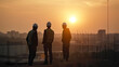 © Schizarty - Group of workers on a construction site during the sunset