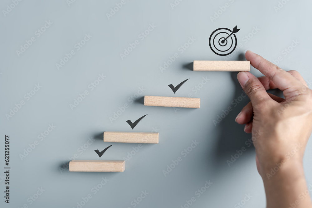 Business growth success achievement concept, hand arranging wooden ...