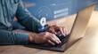 © Malambo C/peopleimages.com - Hands, developer on laptop and hologram for login, cyber security software or code. IT, typing and programmer with keyboard, lock overlay or cryptography for data safety, information technology or ui