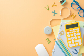 study essentials laid out on pastel orange backdrop with space for text. top view of stationery, cop