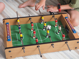 Wall Mural - Table football game with players, close-up, selective focus.