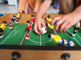 Wall Mural - Table football game with players, close-up, selective focus.