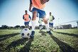 © Daniels C/peopleimages.com - Football, men and exercise with action, field and wellness with workout goal, fitness and competition. Male players, guys and athlete with a challenge, soccer and sports with energy and training