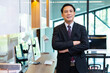 © NVB Stocker - Male crossed arms suit. happy mature Asian man looking at camera. Portrait of Confident successful business people woking in home office