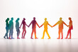 © J S - Paper silhouette figures of people in rainbow color - businessmen and businesswomen, holding and shaking hands as a symbol of cooperation on white background with copy space