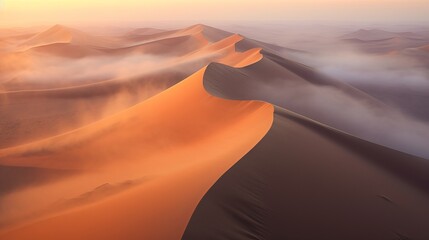 Wall Mural - sunset over the desert - drone shot of sand dunes covered in thick fog, sunrise at the namib desert,