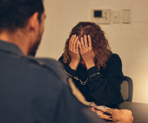 Police, investigation and detective listening to woman for crime interrogation or criminal arrest. Law, crime and man at station for corruption interview, questions in money laundering and handcuffs.